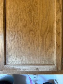 The finish is worn off the kitchen cabinets