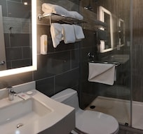 The tub sits higher than than the floor in this room, and water leaks onto the floor.