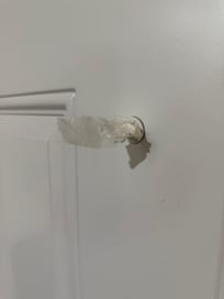 Tissue stuck in peephole.