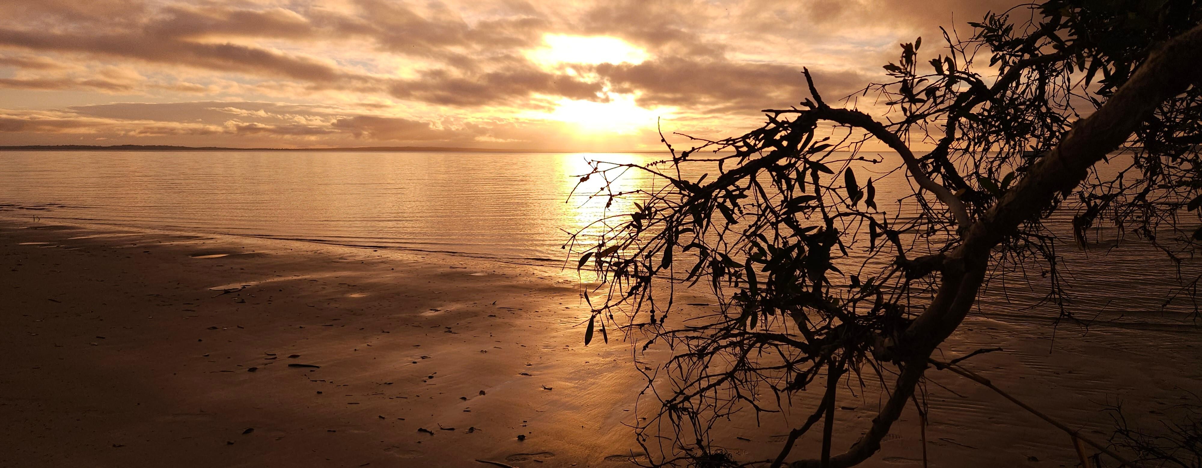 Sunset from the little beach down from the house