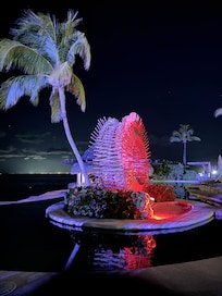 At night by one of the pools