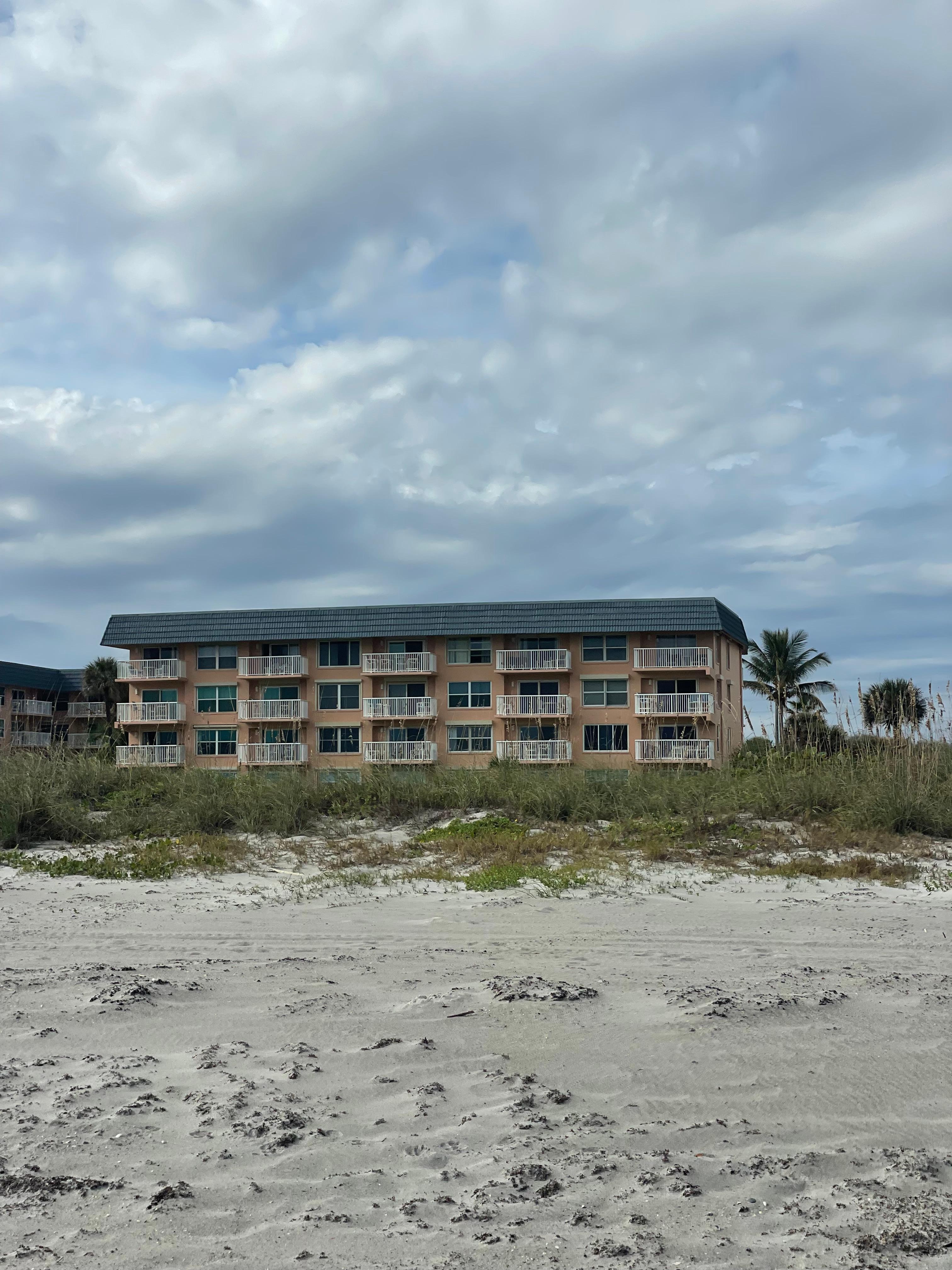 View of the condo from the beach just steps away (top floor 2nd unit from the right)