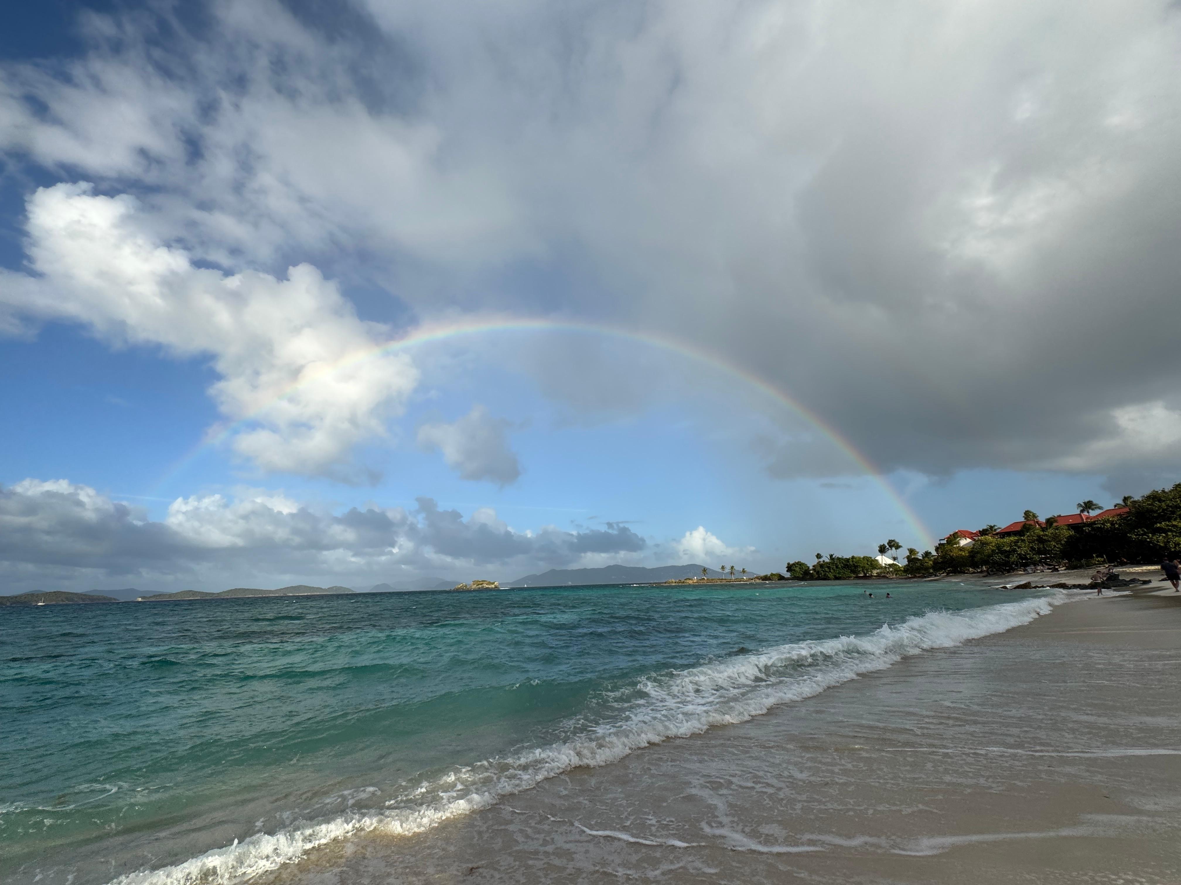 View of the ocean and a beautiful rainbow from the glorious sapphire beach, near the beach bar. 