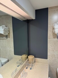 Back corner leaking from the ceiling down onto the little bucket in the corner