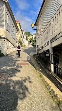 located on a steep hill requiring a strenuous walk up and down a very steep slope each day