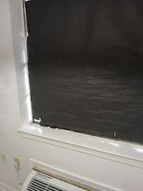 Blinds in windows torn and riped up