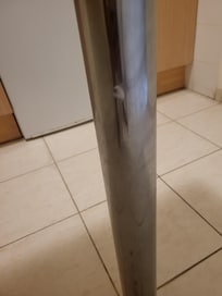 Unknown white gloop on kitchen island pole