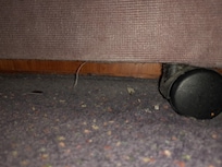 Underneath the bed not been hoovered in a long time. And all the chrome work. electrical heater very rusty