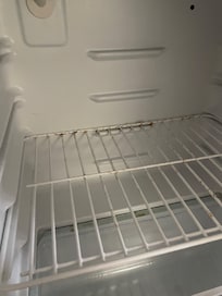 the fridge was rusty and smelled like old food