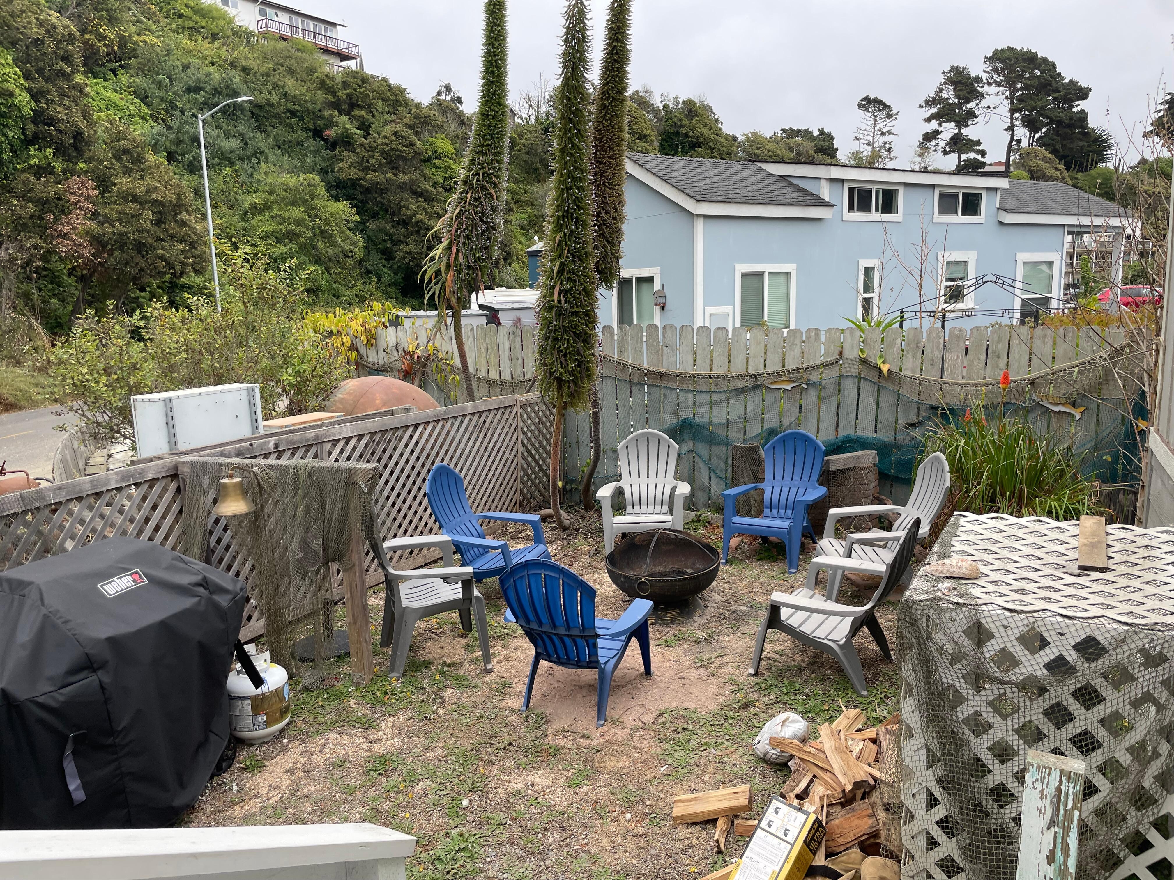 Backyard, partially fenced.