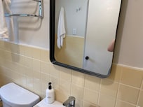 Nowhere to plug in hair tools. No counter space in bathroom