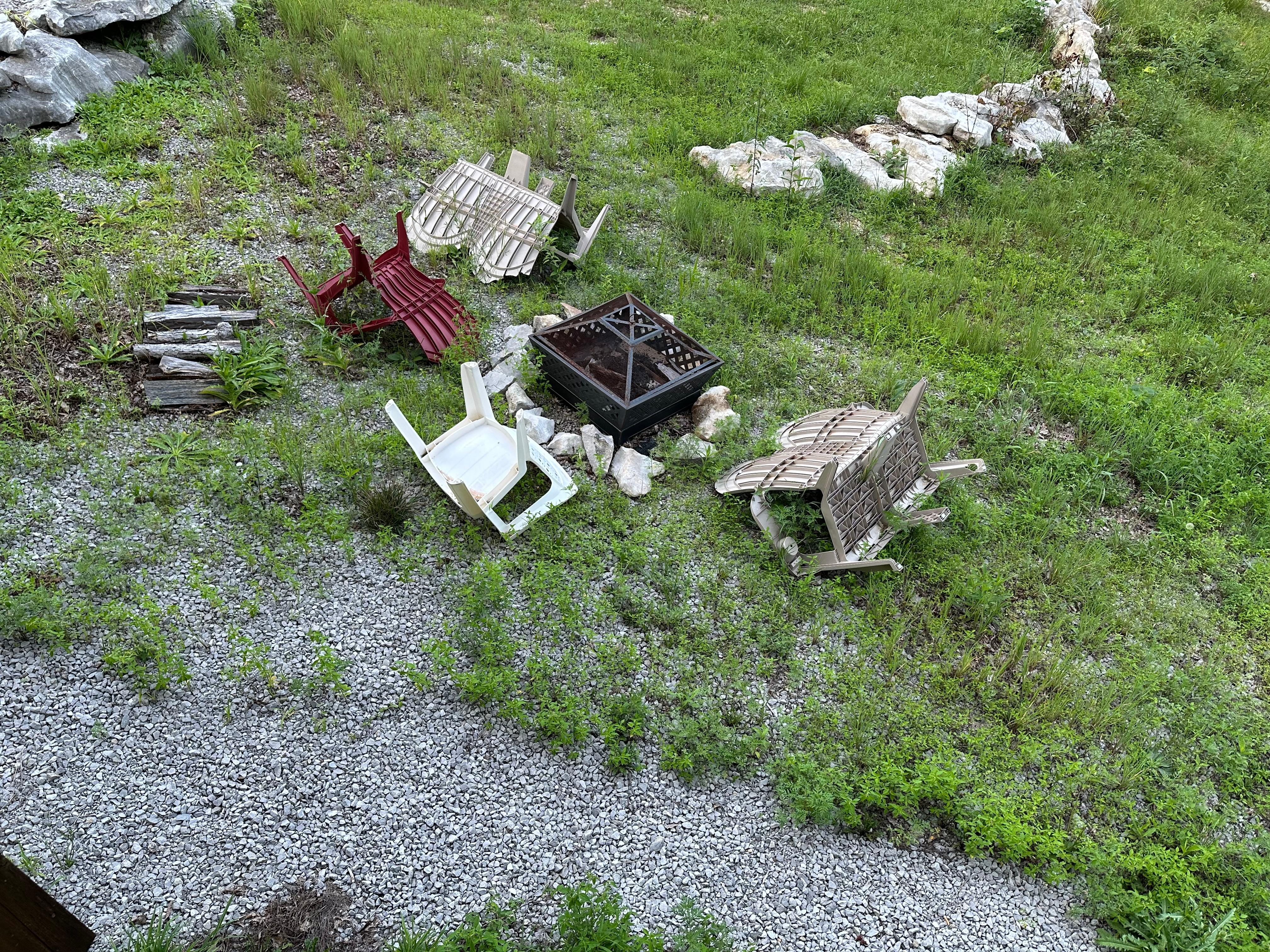 The side yard with the fire pit. Not maintained 