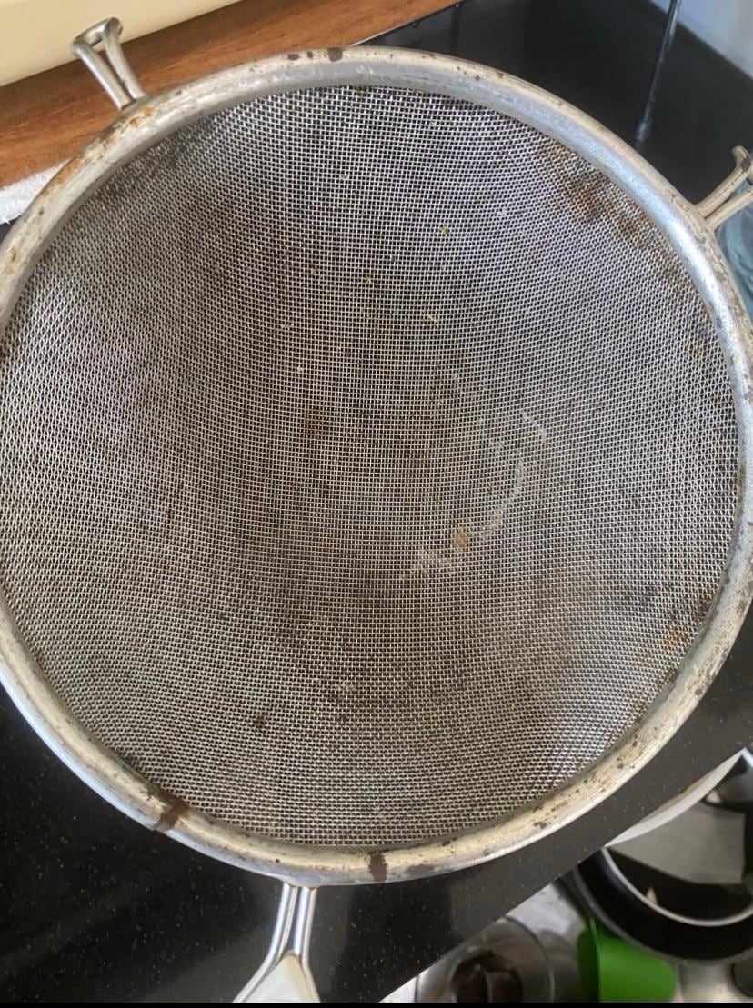 Rust and dirty colander found in kitchen cupboard