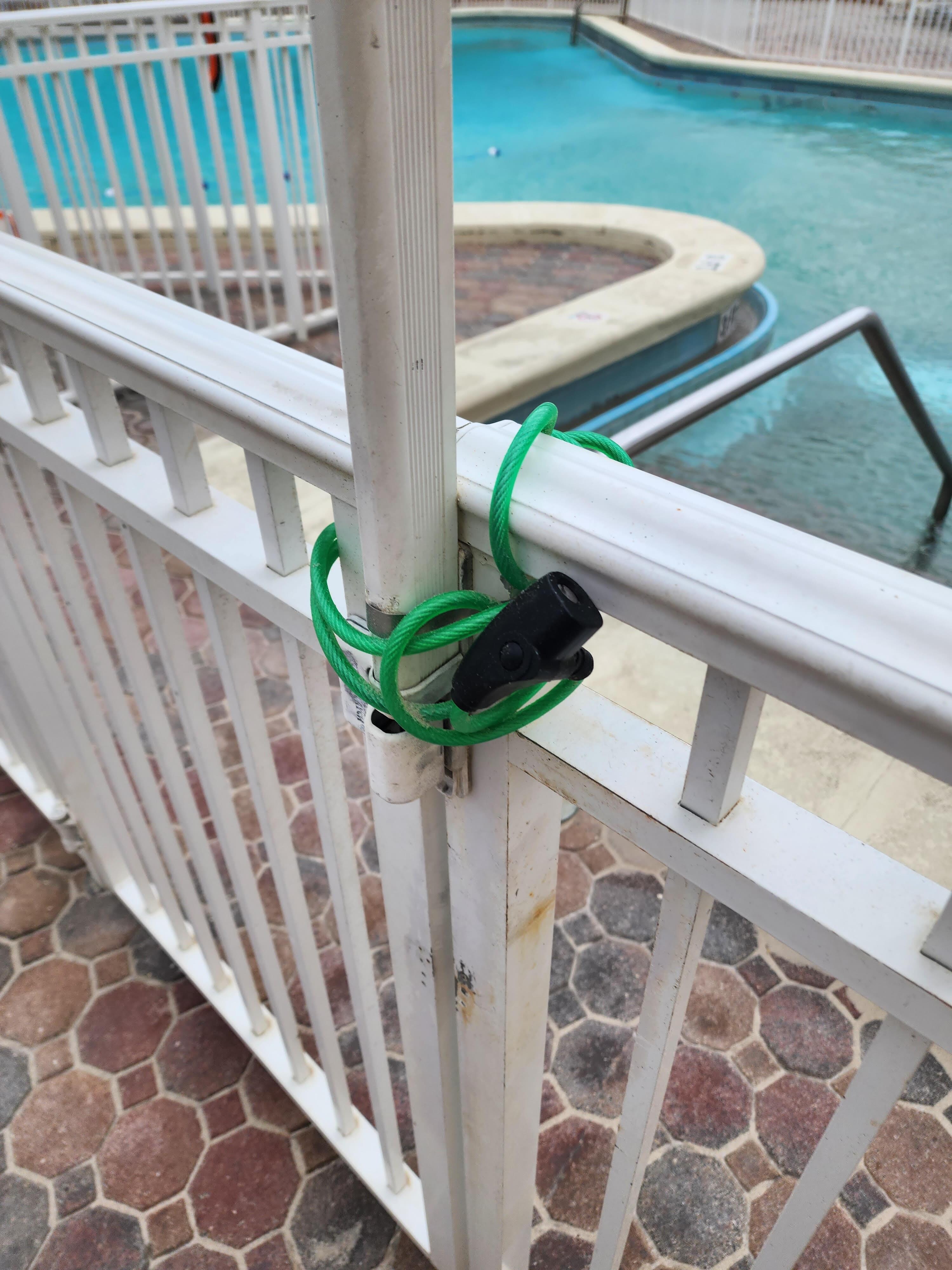 The open pool that was locked by a bike lock on the gate