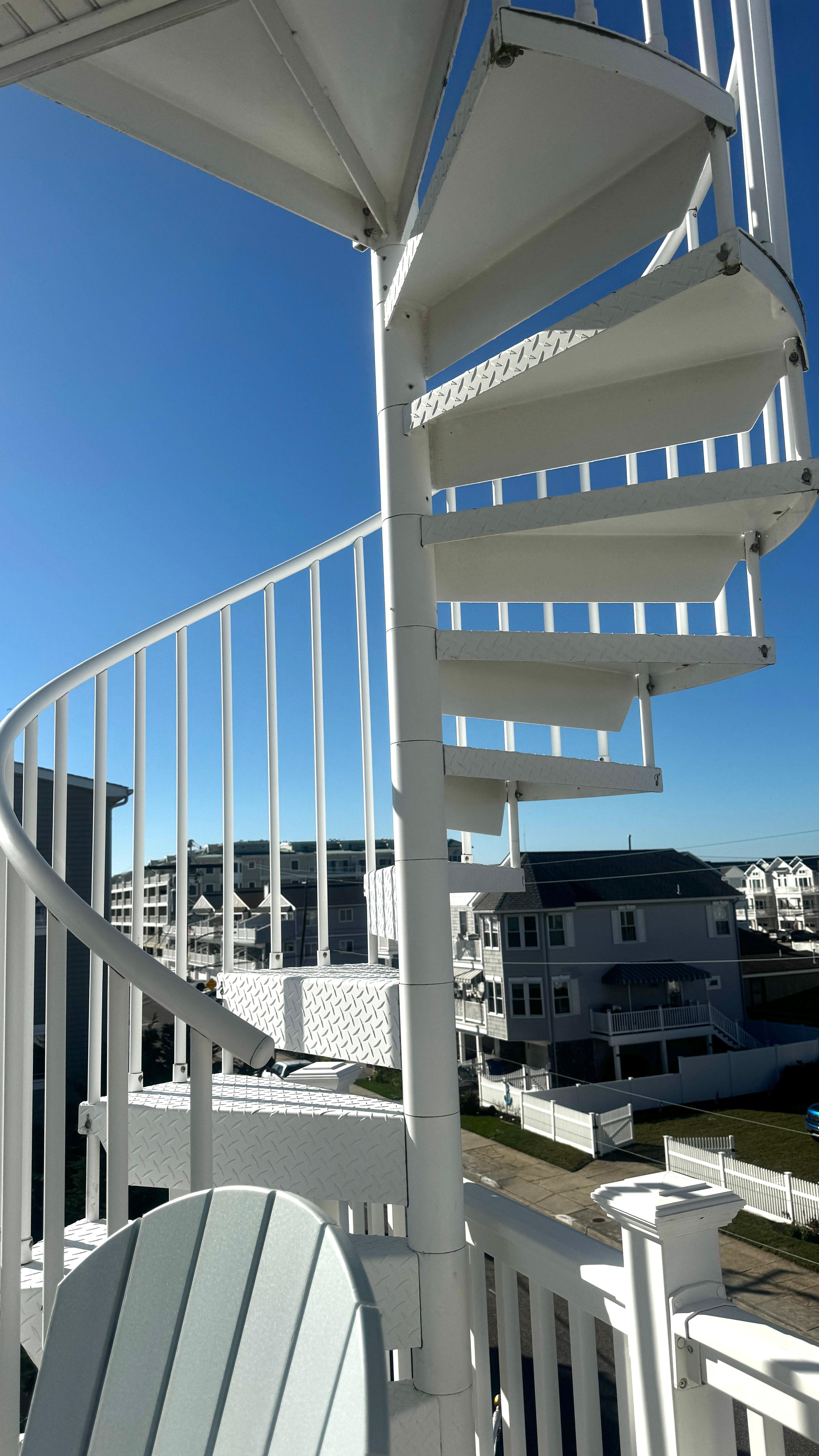 A picture showing the staircase that goes to the deck at the top of the house. What a view!