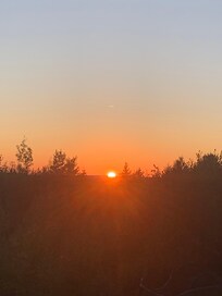 View from bathroom Moose room. Able to see sunrise and sunset through windows.