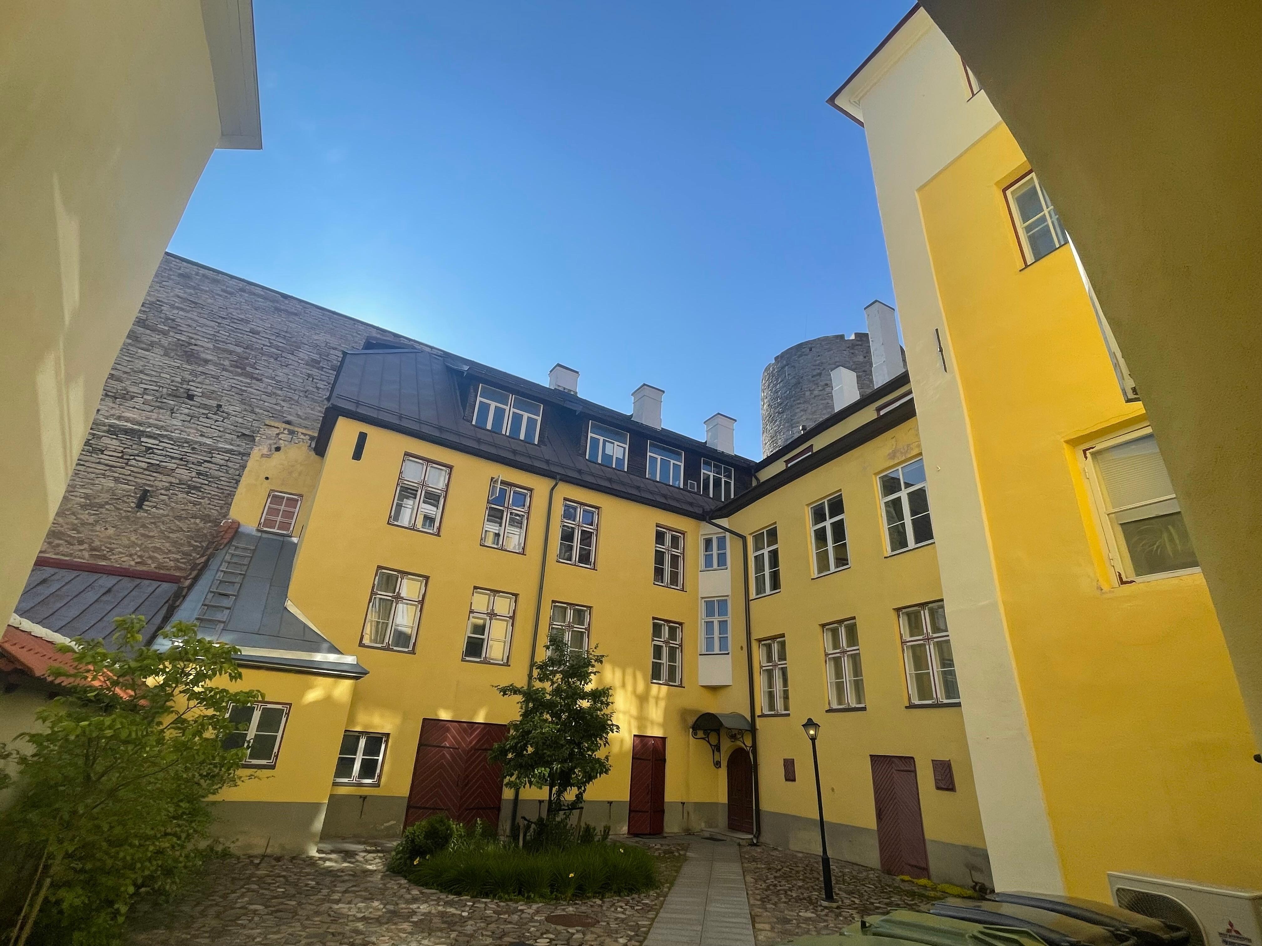 courtyard — apartment has the three windows on the secon floor, right side
