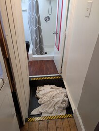 Deep step down, then up to bathroom.