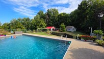 Pool with cabin in the background