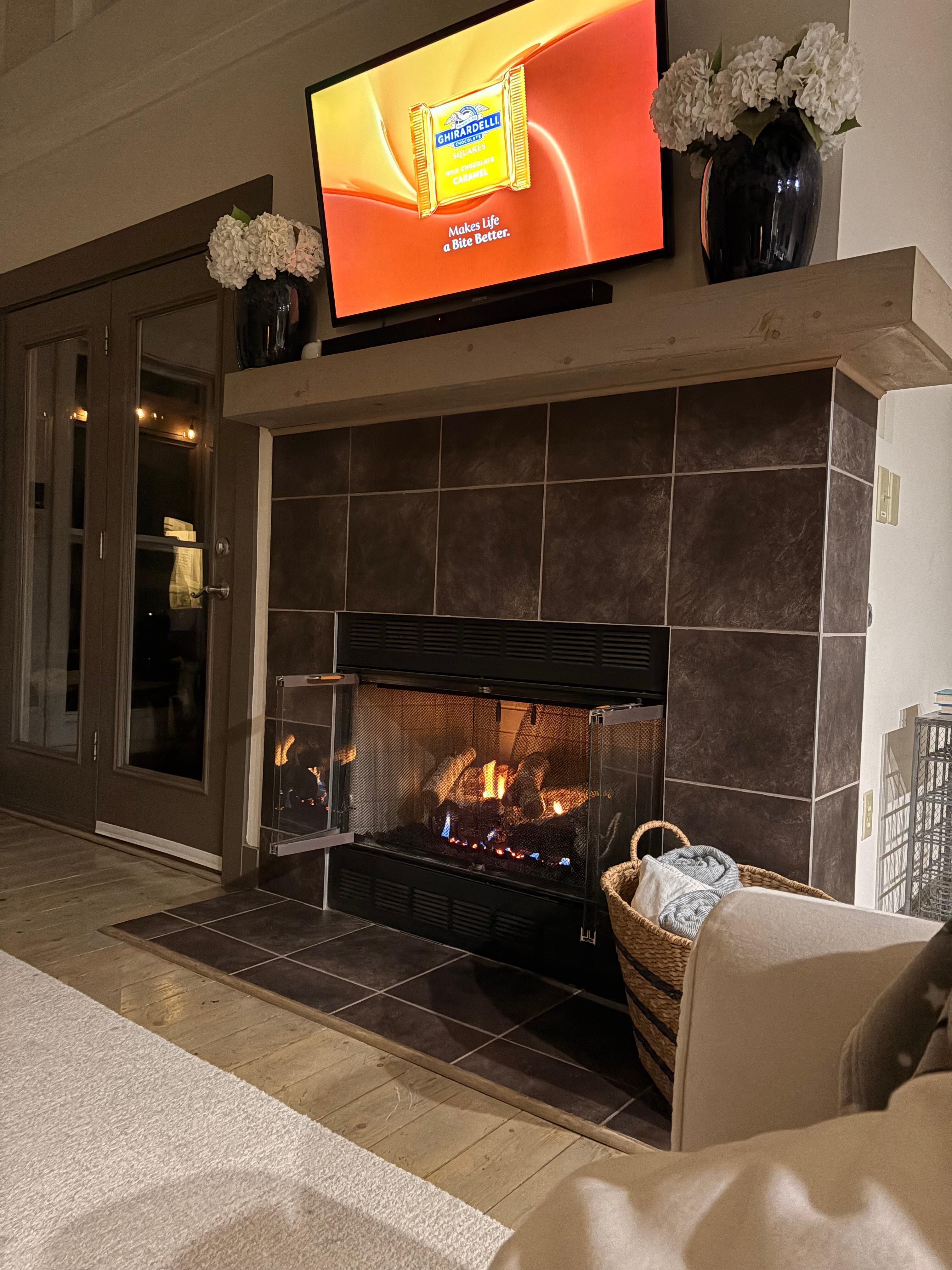 Nice, cozy fireplace to sit and watch TV. 