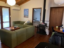 Inside the cabin, great wood heater, or split system.