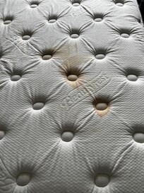 red stain on mattress (looked like blood)
