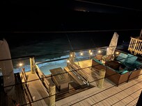Deck outside at night with lights on
