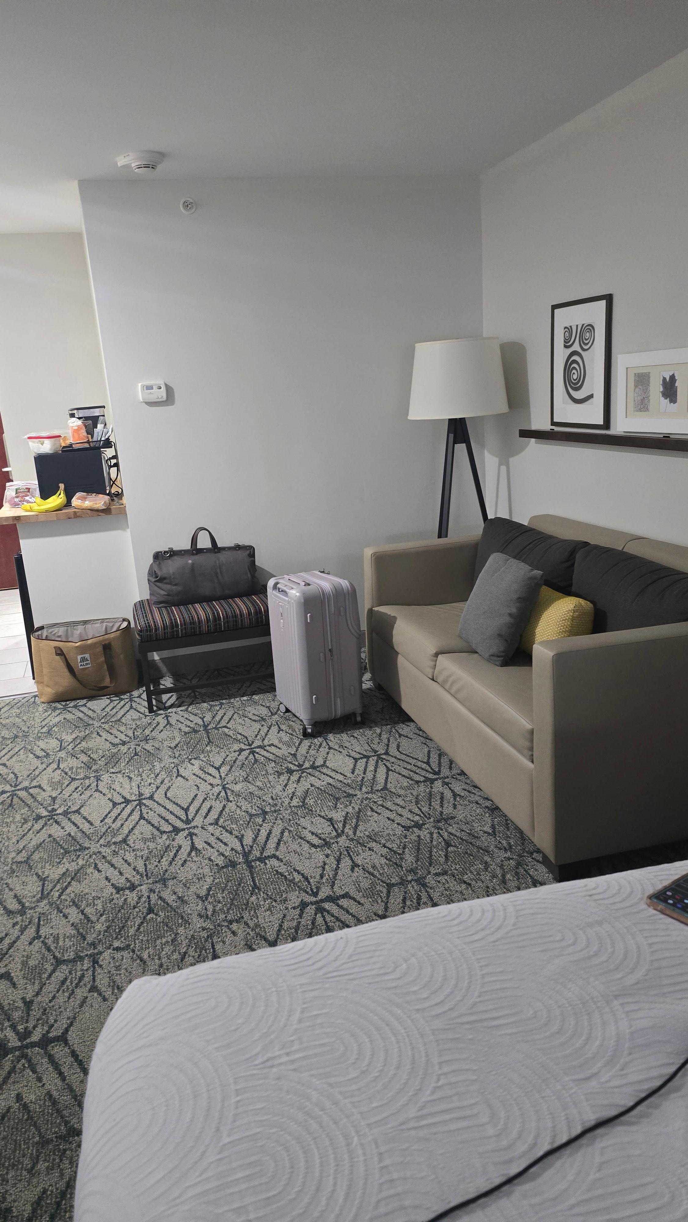 Double sized room.  Sitting area, table, mini sink, fridge only, microwave, large bathroom and shower.  