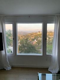 View from apartment. Enchanting sunsets and the hills sparkle at night,