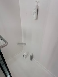 Shampoo and conditioner on floor