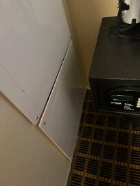 2 pieces of plastic covering bathroom plumbing