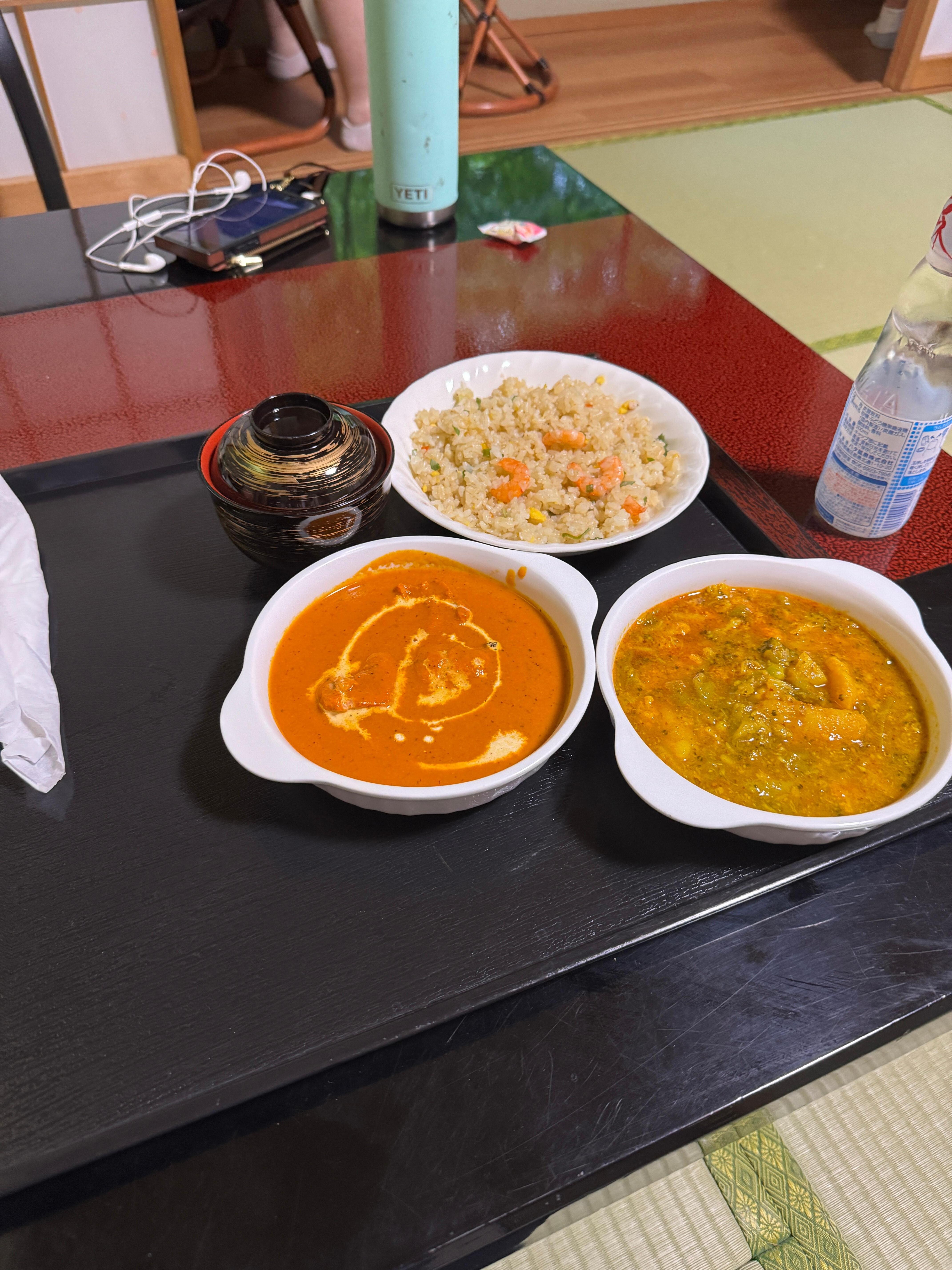 Room service—shrimp rice, butter chicken, and vegetable curry. It was all delicious!