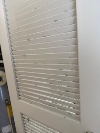 Dust on door from heating vent in closet