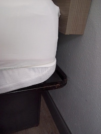 Some rusty signs on bed frame. Normal size fitted sheet on deep mattress.