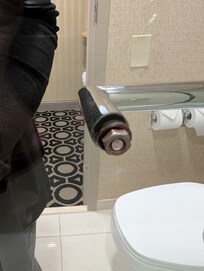 Just a hex nut to open shower. Maintenance said they were all like that