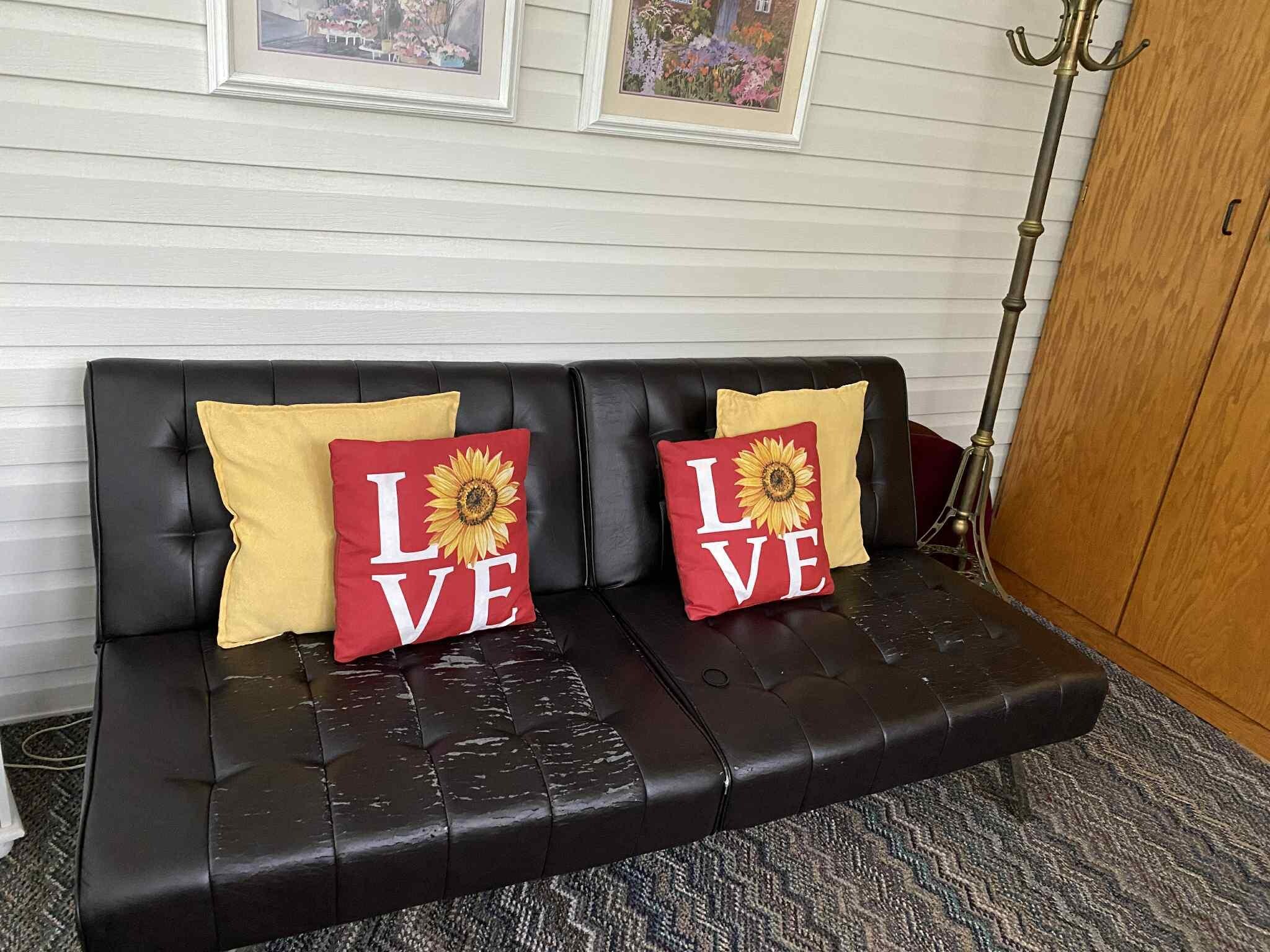 Room off kitchen with couch for extra sleeping. This couch in the listing doesn't show any wear and tear.