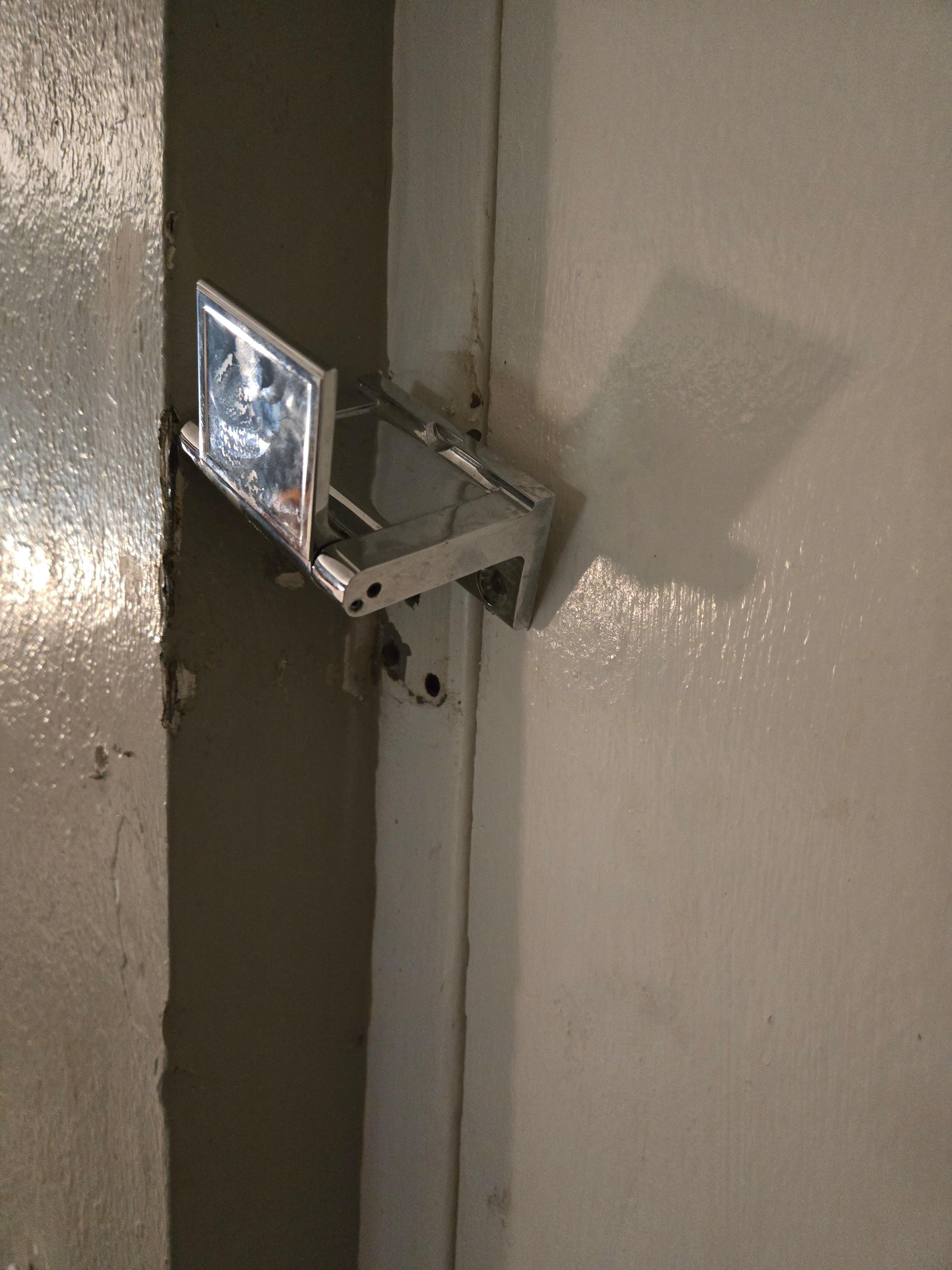 The security latch inside the room was missing the screws to the door frame, thus didn't really function.