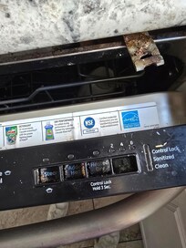 Broken dishwasher buttons and DW detached from cabinet, falling out when opened.