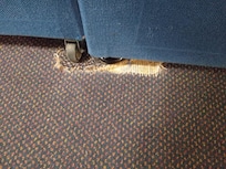 Worn carpet by thebed