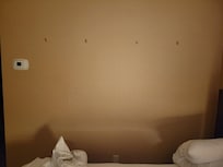 Holes in walls showing pictures werenât securely hung