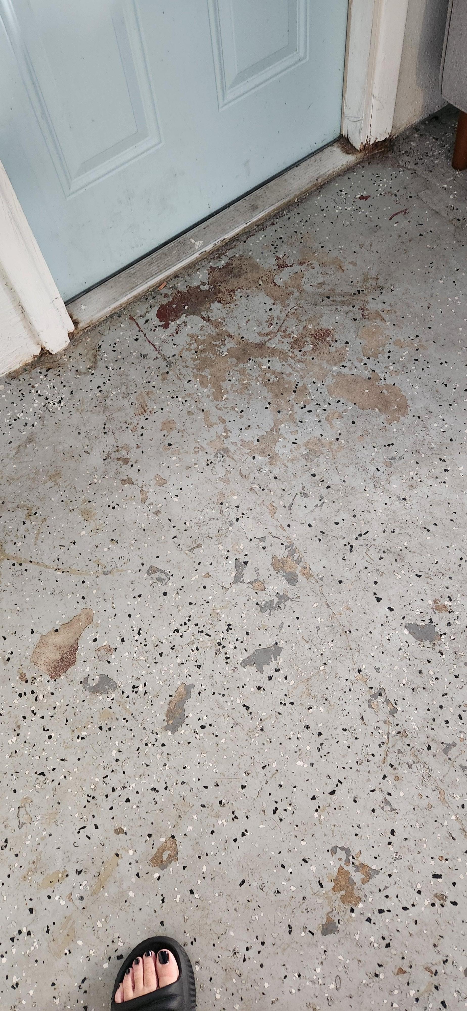 Filth on garage floor, stained and sticky