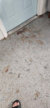 Filth on garage floor, stained and sticky