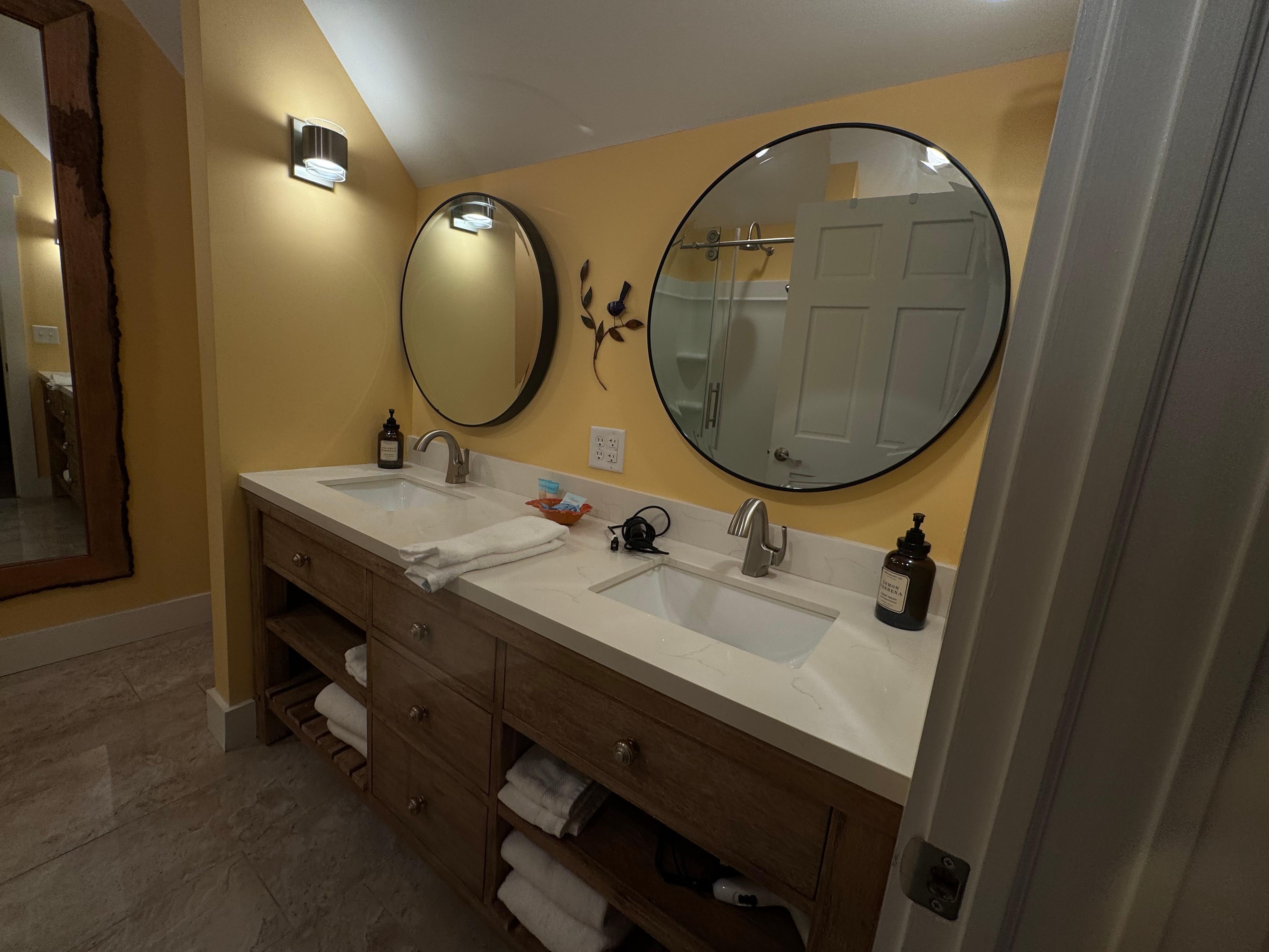 Clean double sink bathroom. Stocked with towels, hair dryer, shampoo/conditioner, etc