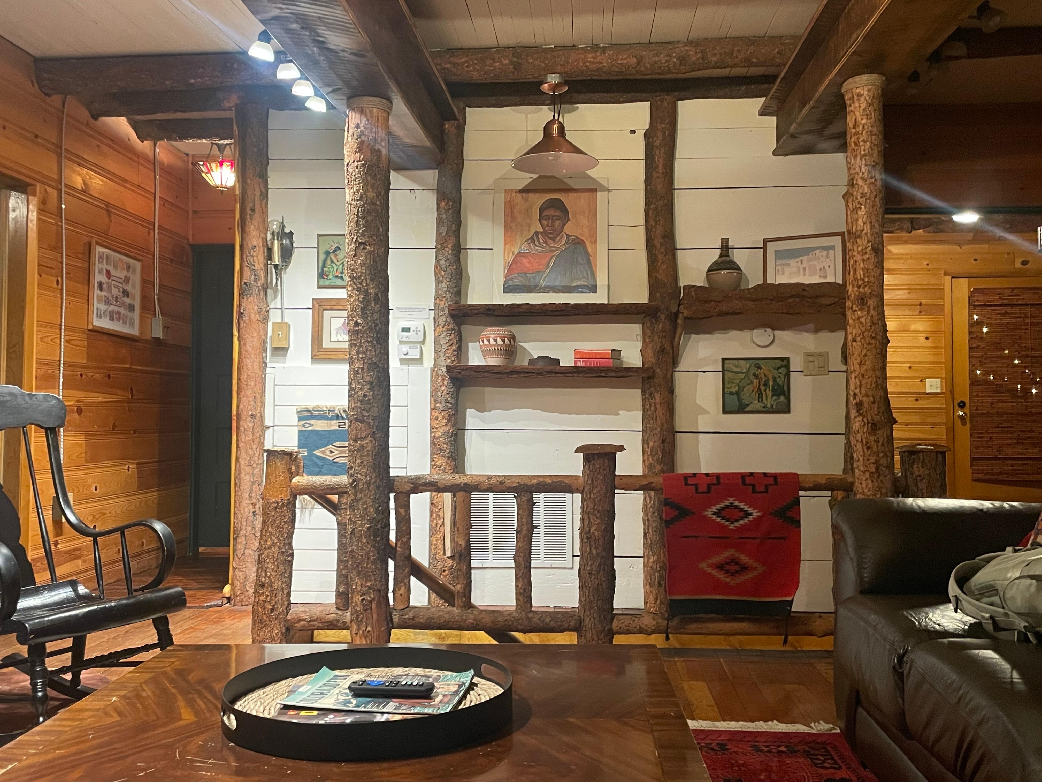 Cozy second level living room with a fireplace. 