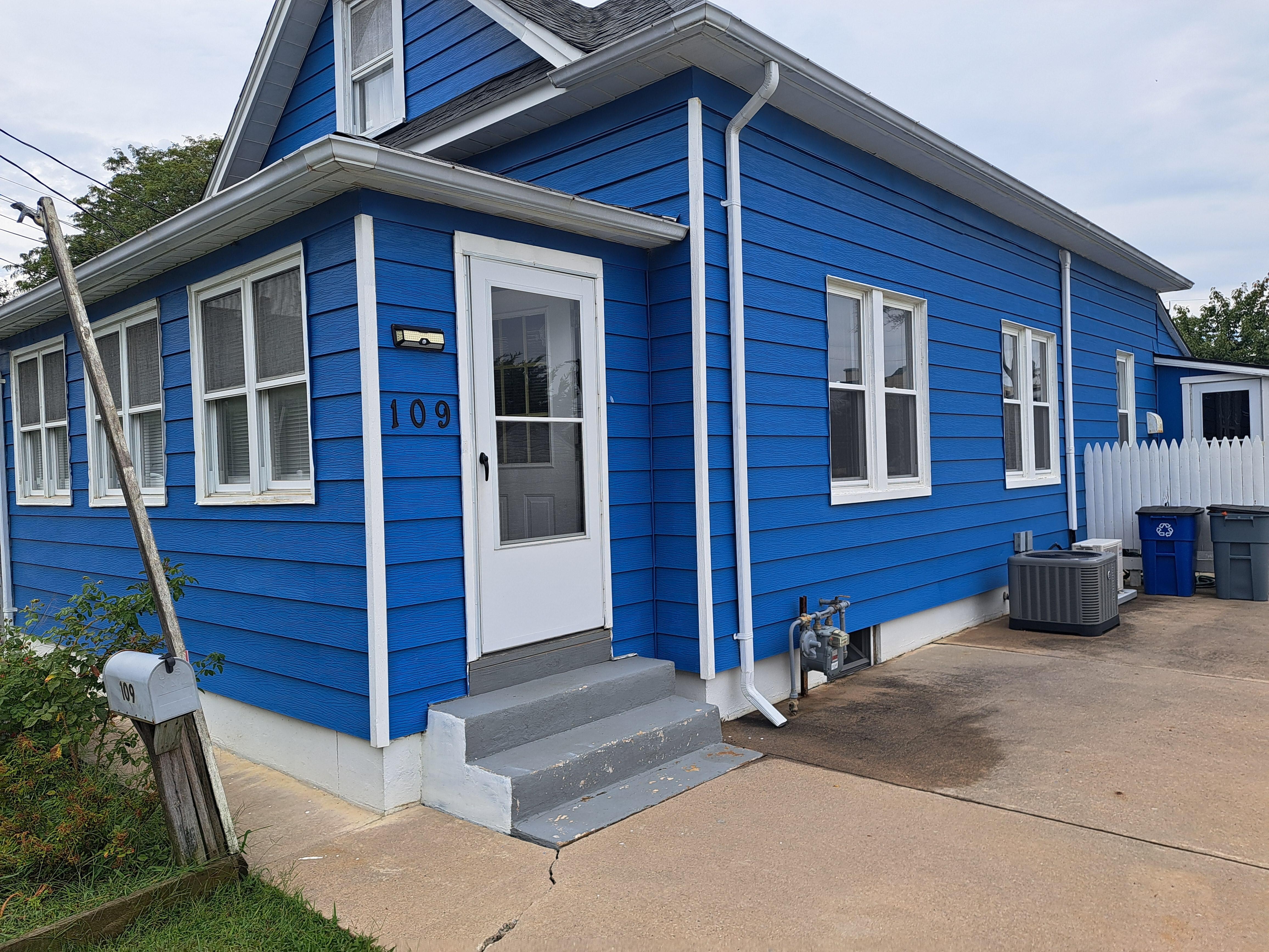 House entrance right off driveway. Has a nice side yard.