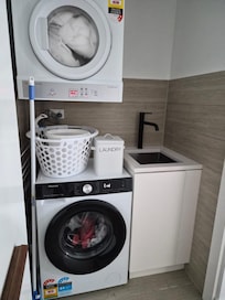 Full laundry, can do your washing, property managers provided us with laundry detergents. There is a steam iron in the unit.