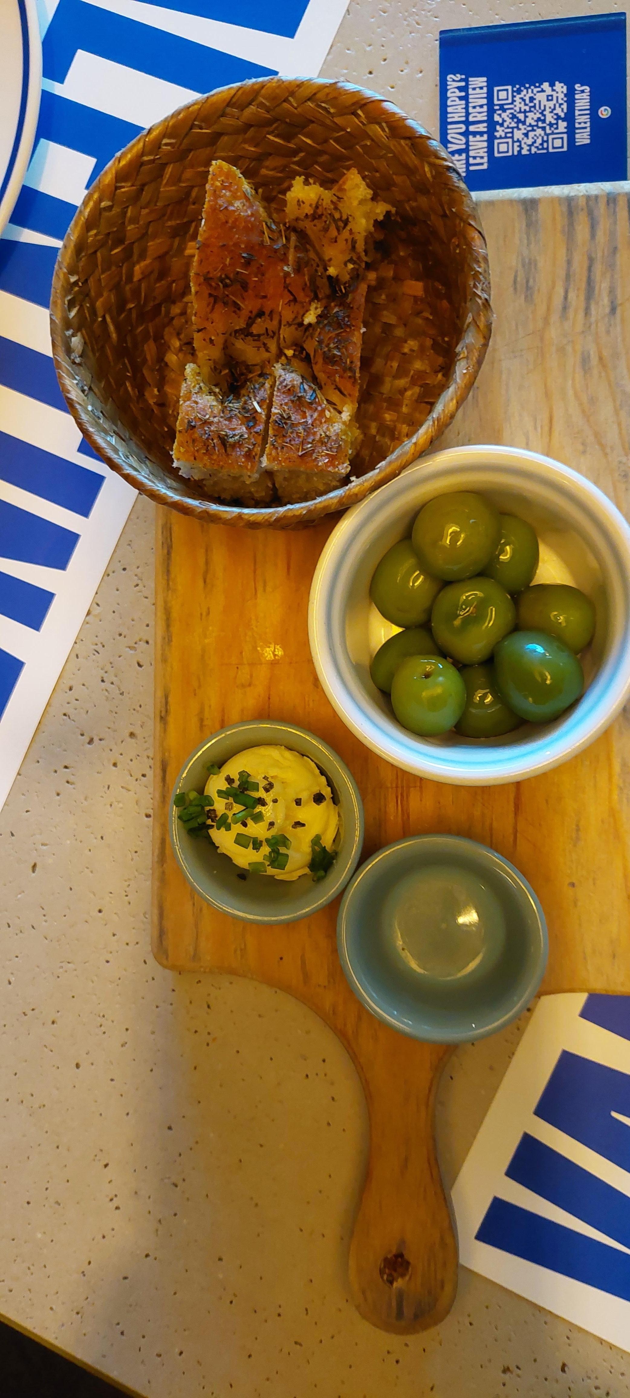 Couvet. Freshly baked bread with truffle butter and Sicilian olives. So good!!