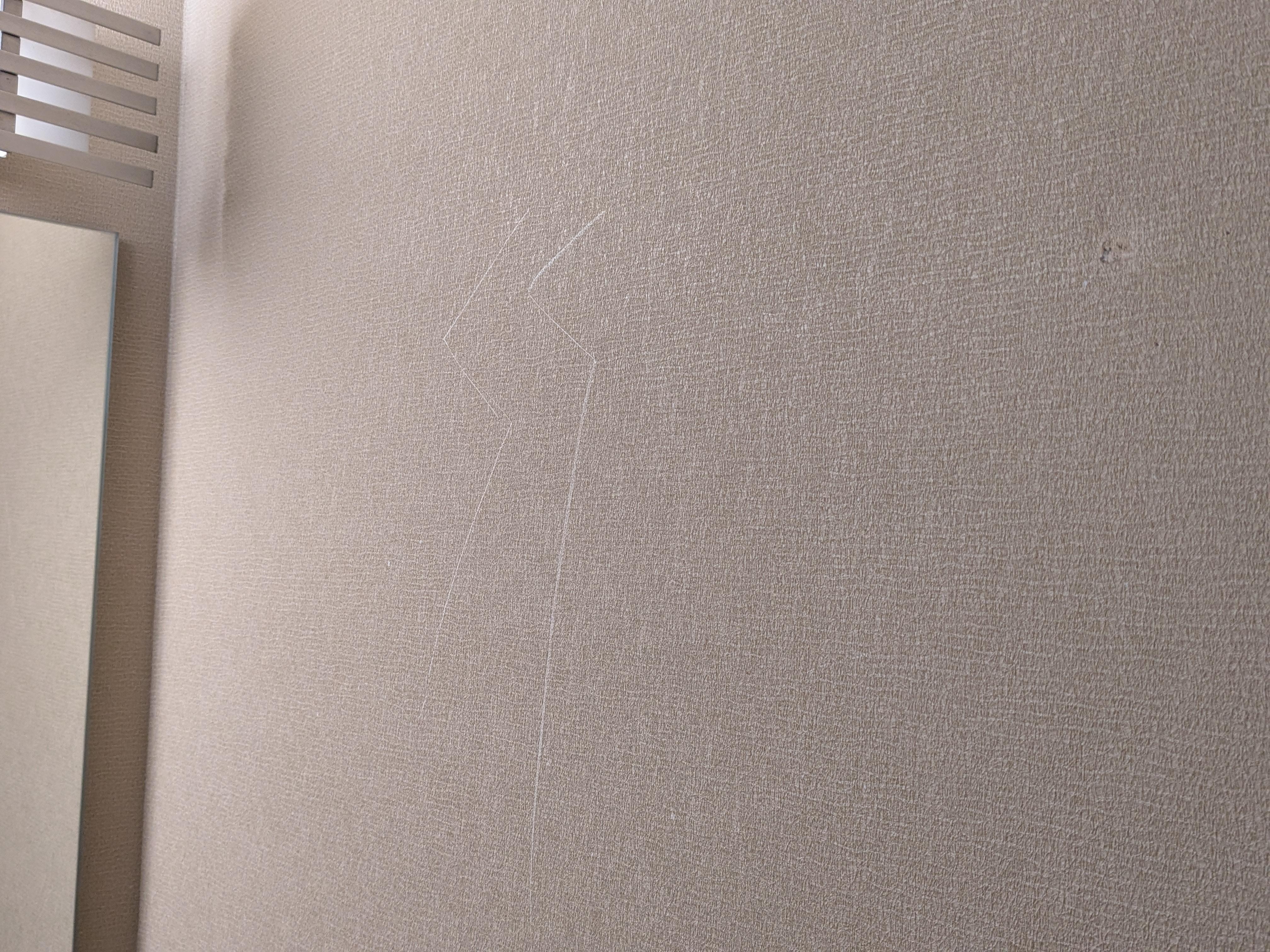 "SS" was carved into the wall by the bathroom mirror/sink.