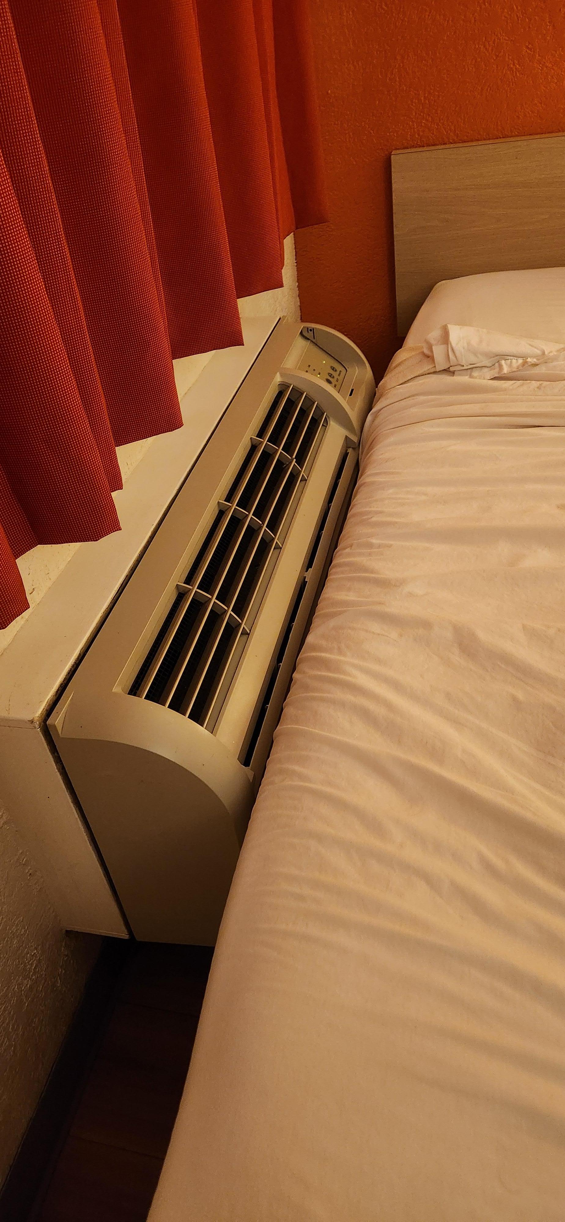 Why would anyone shove an air and heating unit up against the bed??