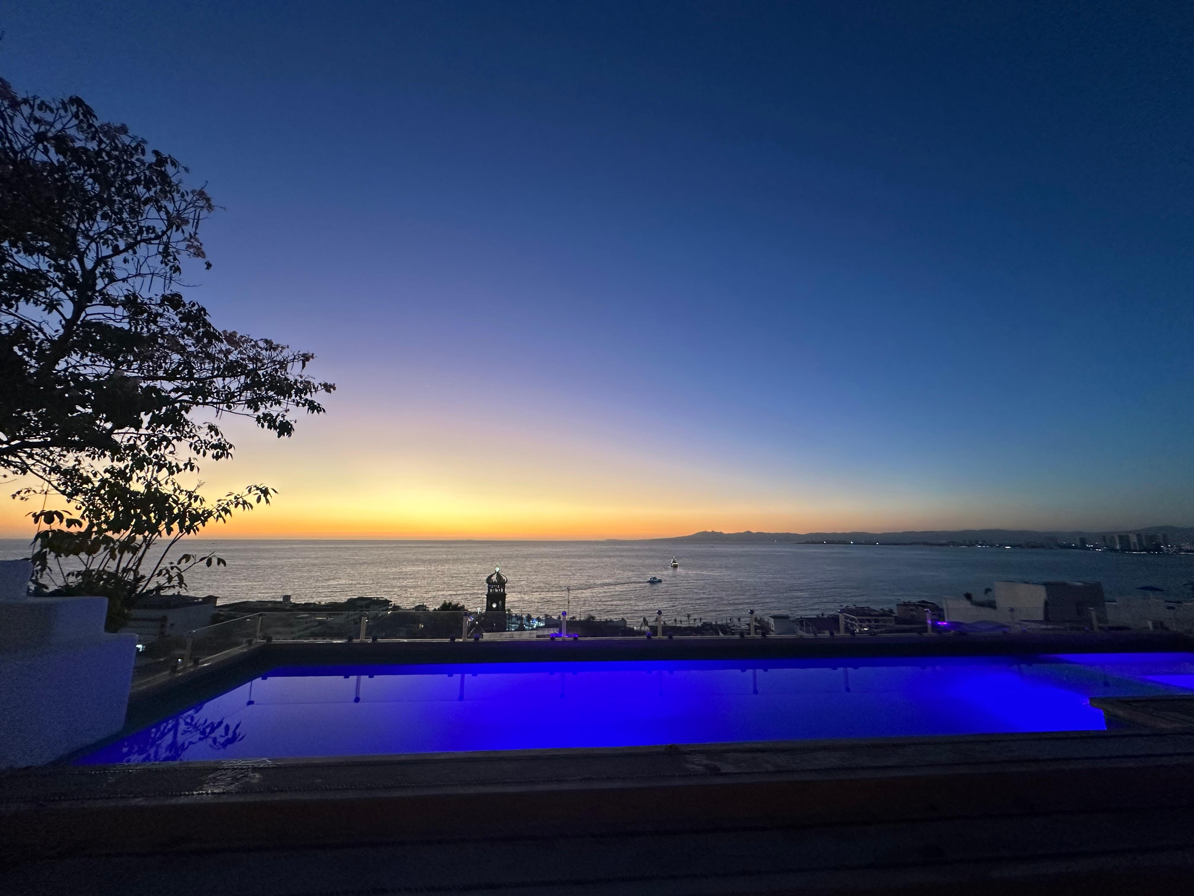Rooftop pool after sunset 